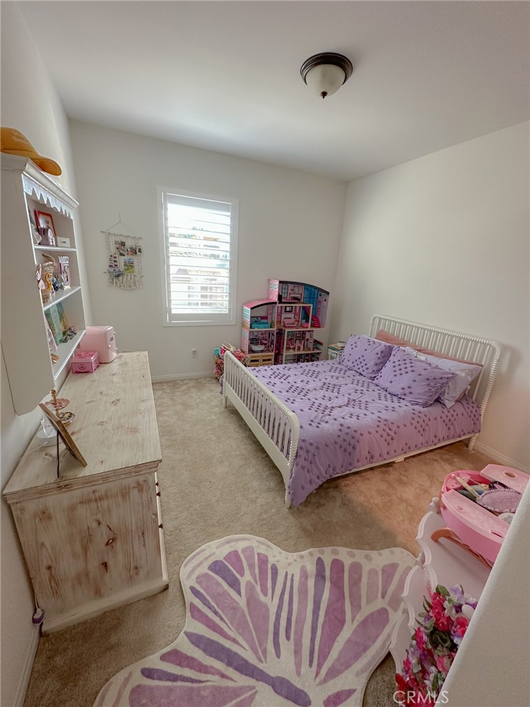 39547 Verbena Way Temecula, CA 92591 - Photo 16 of 31 a bedroom with furniture and a couch
