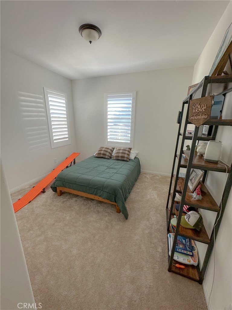 39547 Verbena Way Temecula, CA 92591 - Photo 18 of 31 a bed room with a bed and a window