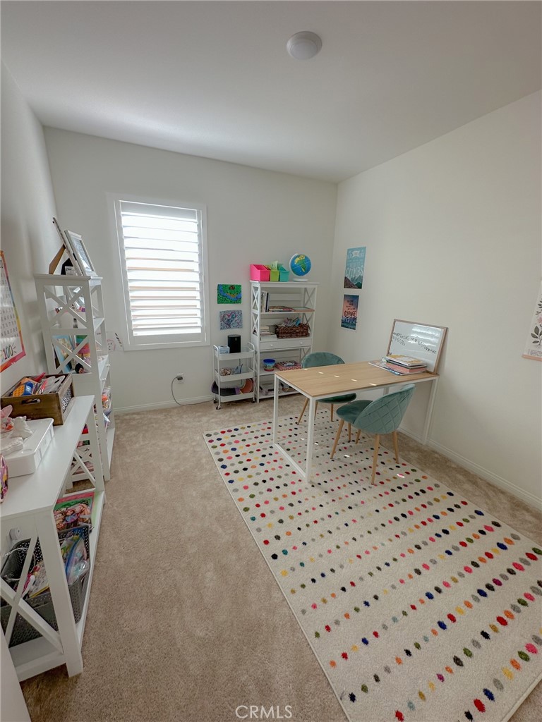 39547 Verbena Way Temecula, CA 92591 - Photo 19 of 31 a living room with a couch and a table