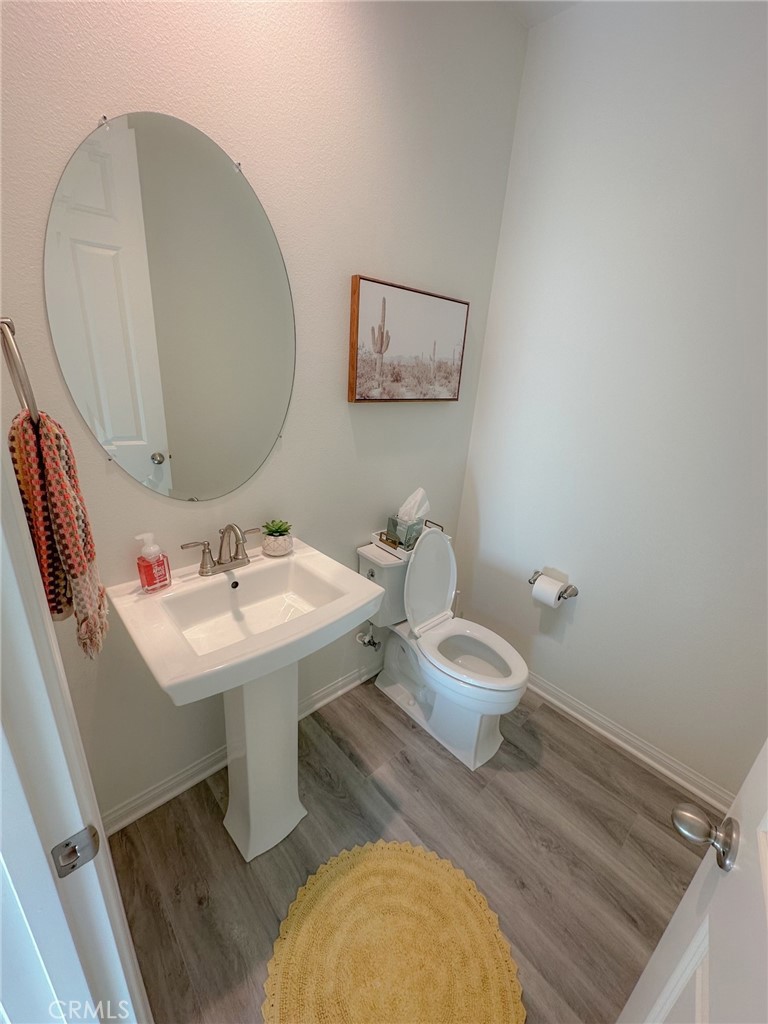 39547 Verbena Way Temecula, CA 92591 - Photo 22 of 31 a bathroom with a sink mirror and toilet