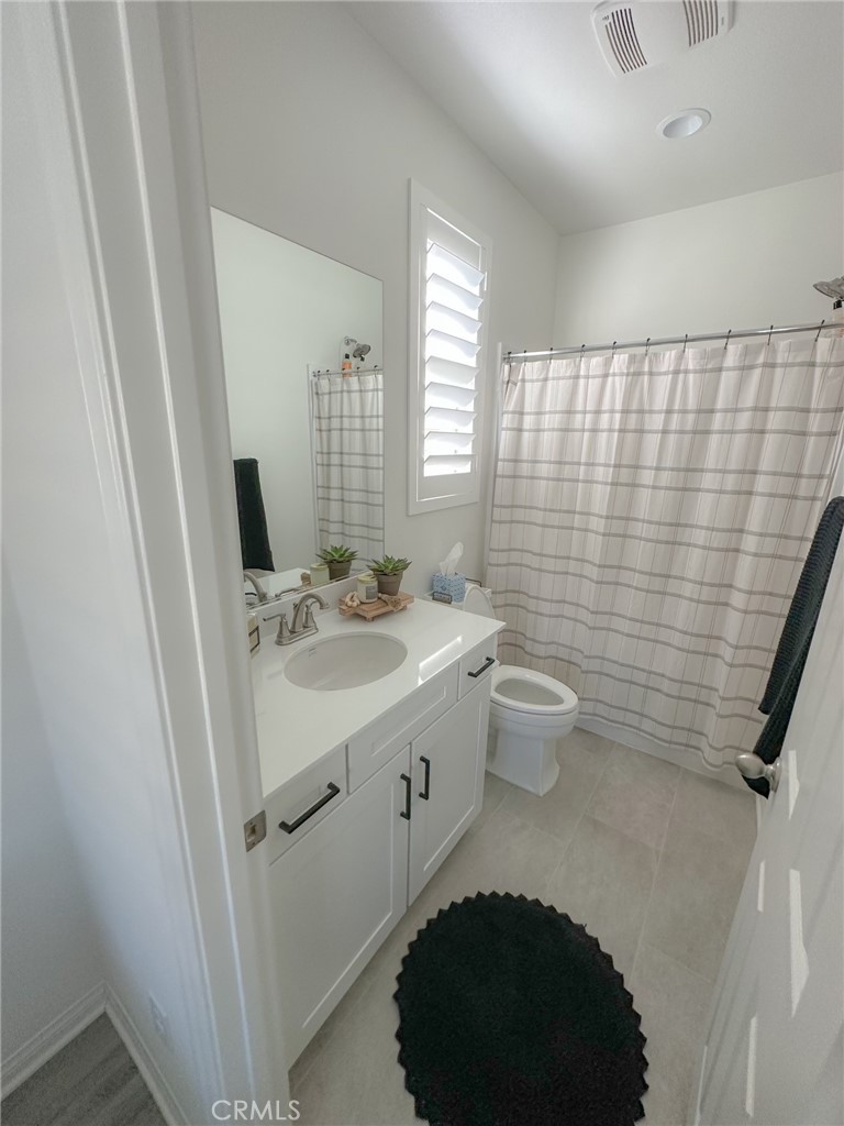 39547 Verbena Way Temecula, CA 92591 - Photo 23 of 31 a bathroom with a sink toilet and shower