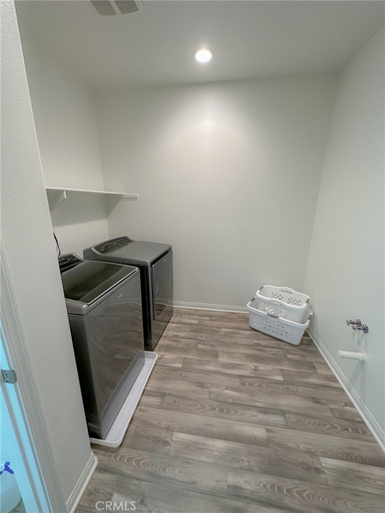 39547 Verbena Way Temecula, CA 92591 - Photo 24 of 31 a view of empty room with wooden floor