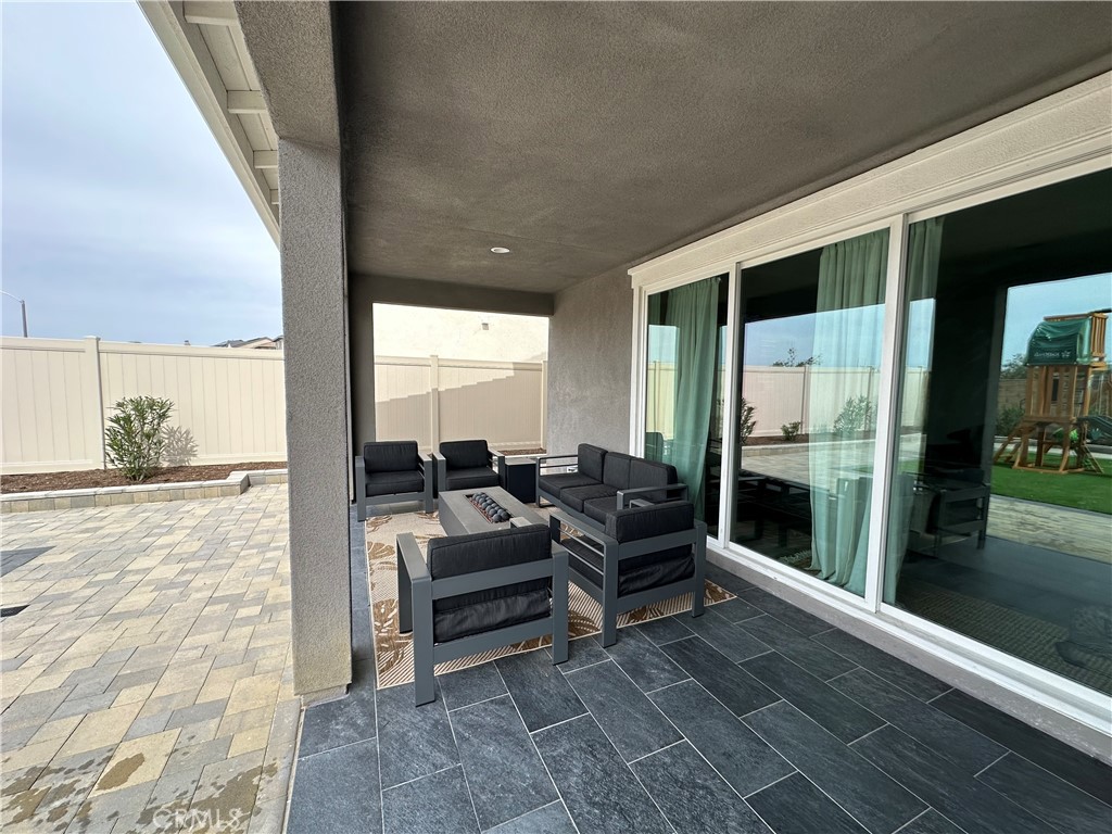 39547 Verbena Way Temecula, CA 92591 - Photo 25 of 31 a view of living room with furniture and floor to ceiling window