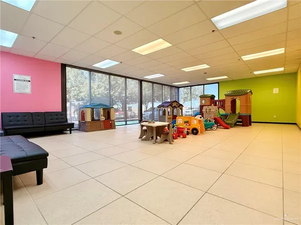 a kitchen with furniture and window