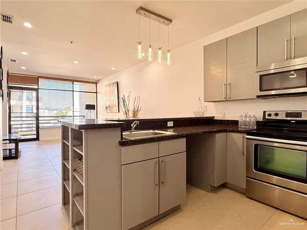 a view of a hallway with paintings on the wall