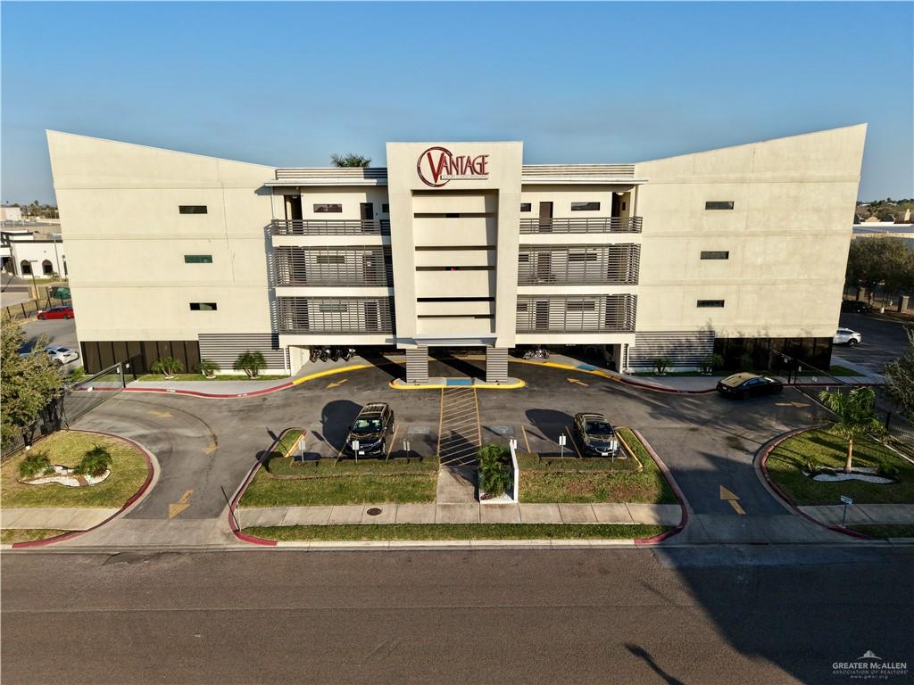 813 Travis Street, Unit 207 Mission, TX 78572 - Photo 2 of 38 a front view of a building with glass windows
