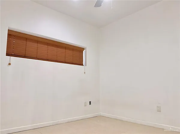 a view of a swimming pool with lounge chairs