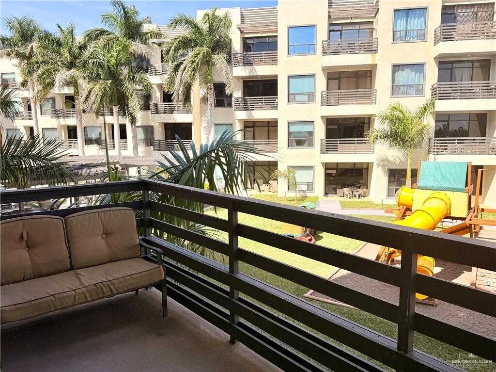 813 Travis Street, Unit 207 Mission, TX 78572 - Photo 23 of 38 a view of a balcony with a couch