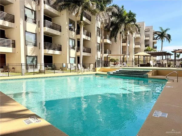 a front view of a building with a yard