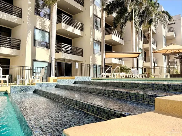 a view of a swimming pool with a patio