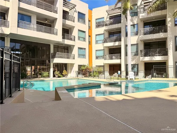 a view of a dining table and chairs in the patio