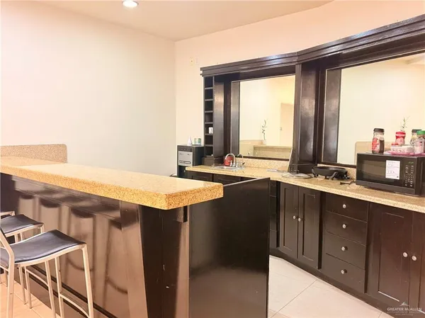 a room with gym equipment and large window