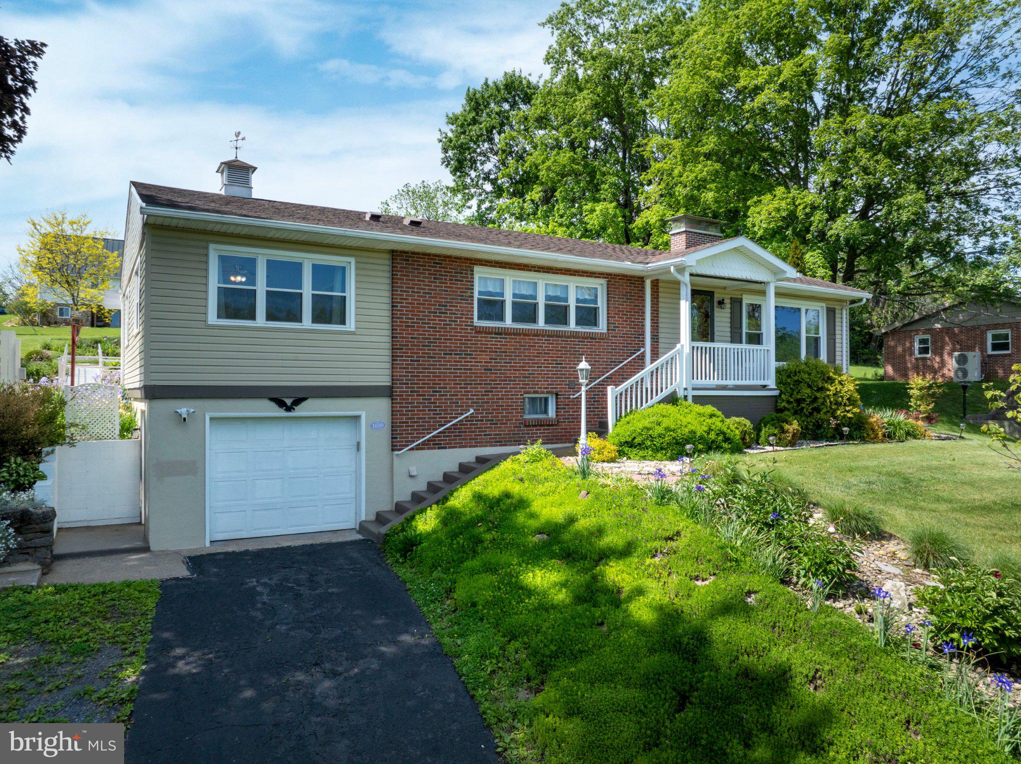 1639 Houserville Road State College, PA 16801 - Photo 2 of 54 Charming home with lush greenery.