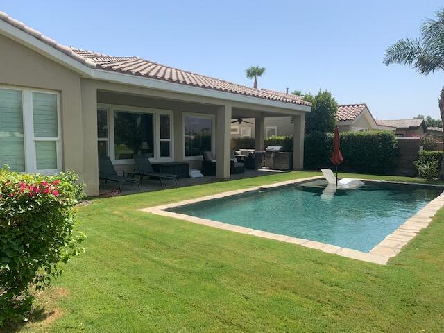 81225 Red Rock Road La Quinta, CA 92253 - Photo 11 of 13 a view of a house with pool and porch
