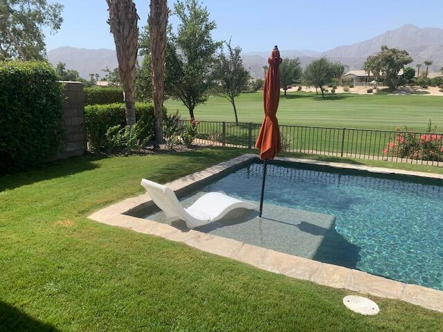 81225 Red Rock Road La Quinta, CA 92253 - Photo 9 of 13 a view of a garden with sitting area