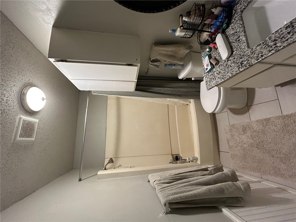 1500 Lemon Tree Lane College Station, TX 77840 - Photo 10 of 17 a bathroom with a granite countertop sink toilet and shower