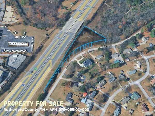 a view of a lake with a yard