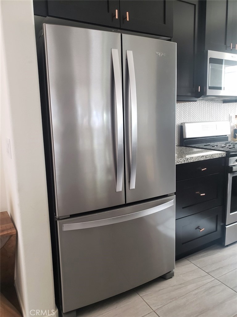 4120 Mission Tree Way Oceanside, CA 92057 - Photo 15 of 56 an empty room with wooden floor