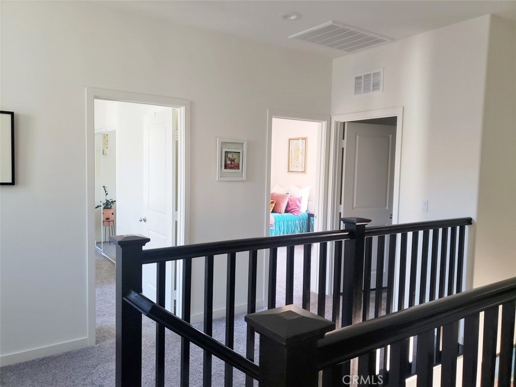 4120 Mission Tree Way Oceanside, CA 92057 - Photo 22 of 56 a view of a porch with wooden floor