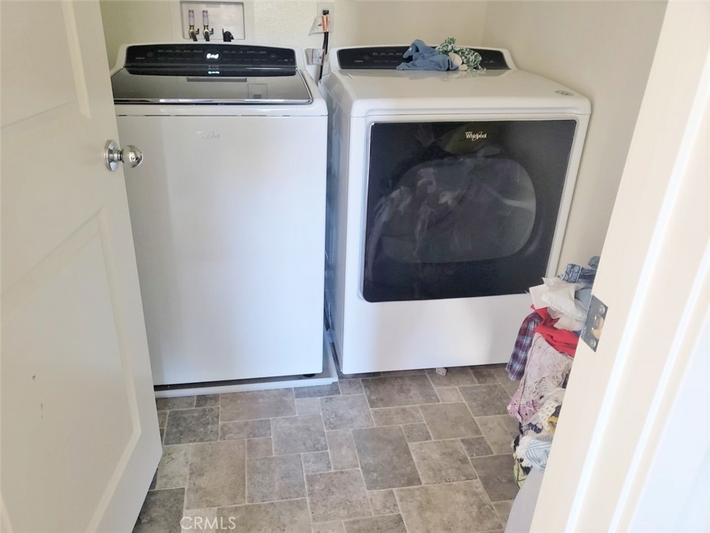 4120 Mission Tree Way Oceanside, CA 92057 - Photo 23 of 56 a utility room with wooden floor washer and dryer