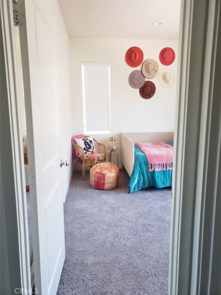 4120 Mission Tree Way Oceanside, CA 92057 - Photo 24 of 56 a bedroom with a bed and a window