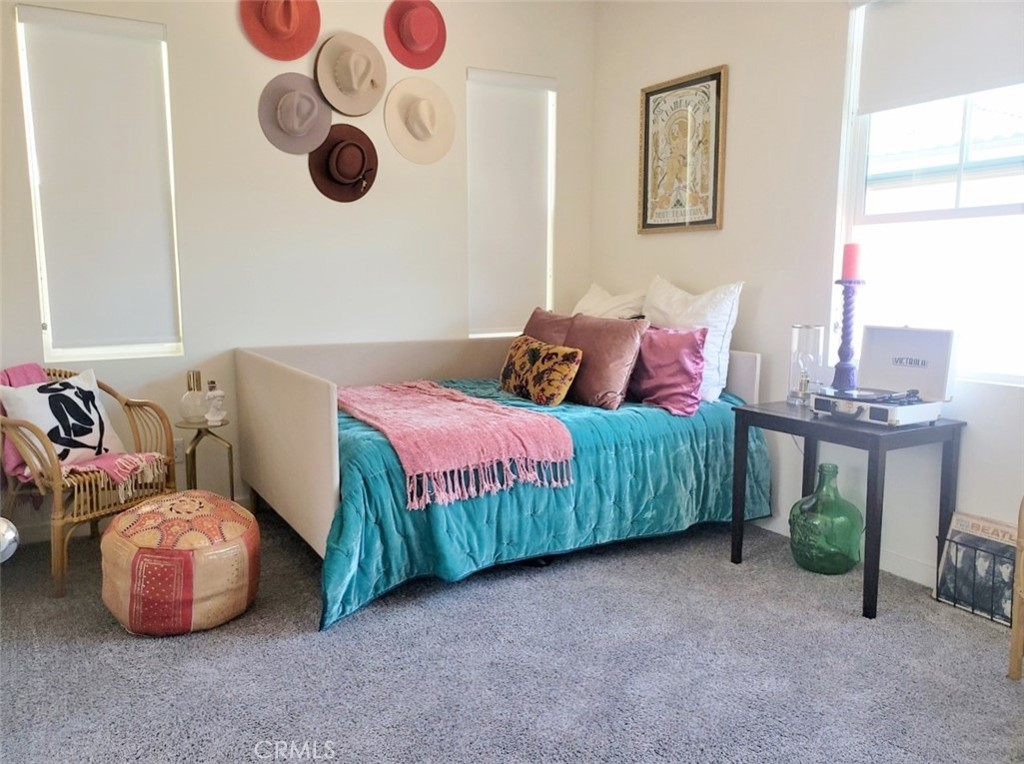 4120 Mission Tree Way Oceanside, CA 92057 - Photo 25 of 56 a bedroom with a bed and cabinets