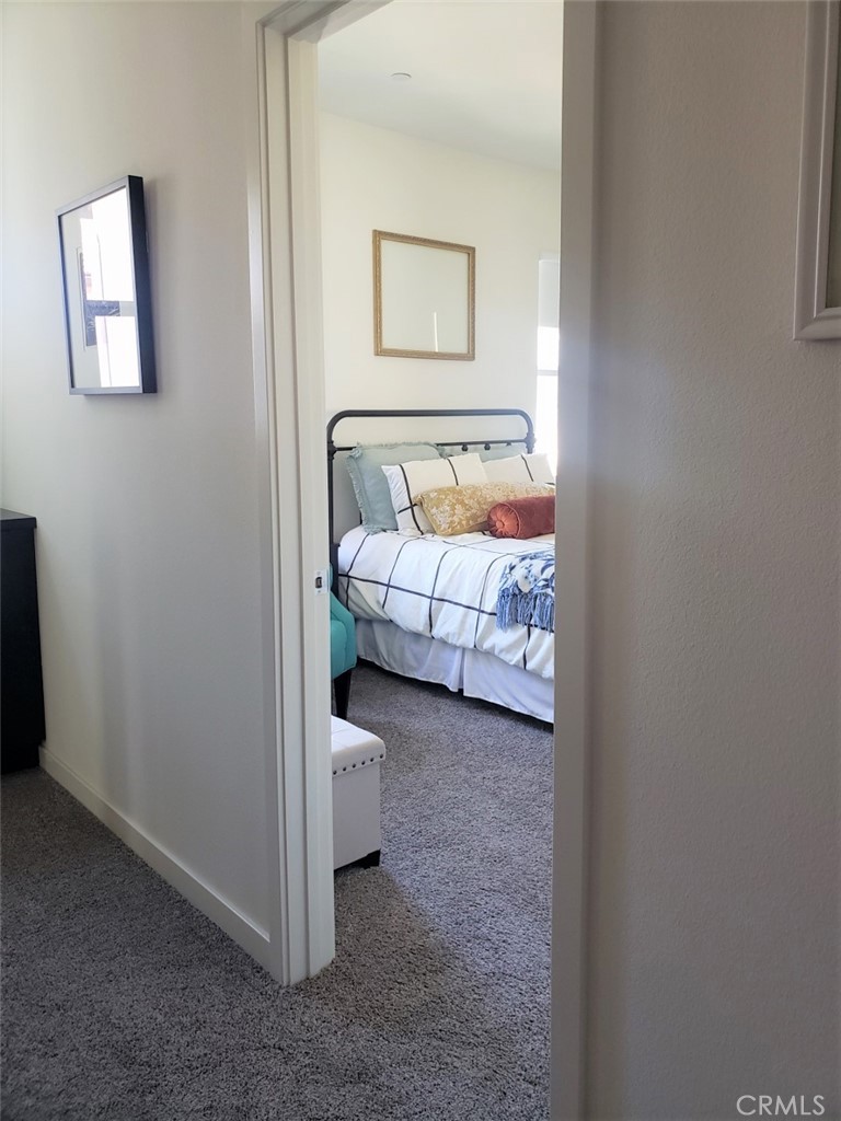 4120 Mission Tree Way Oceanside, CA 92057 - Photo 27 of 56 a view of a bedroom with bed and window