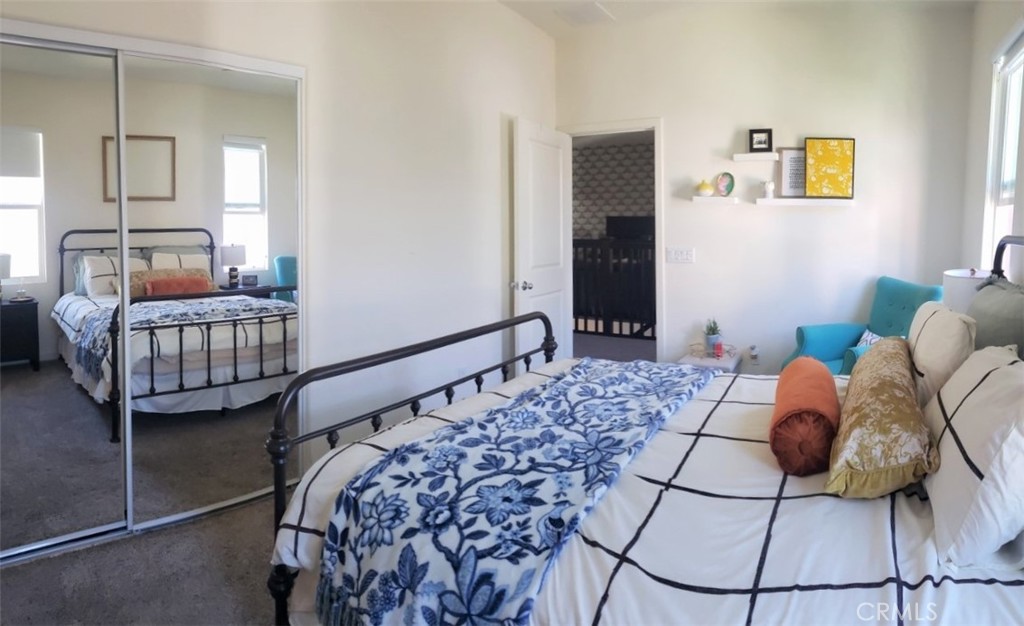 4120 Mission Tree Way Oceanside, CA 92057 - Photo 29 of 56 a bedroom with bed and window