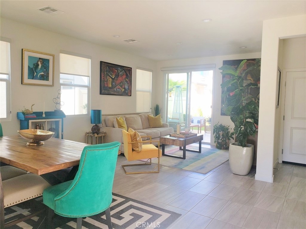 4120 Mission Tree Way Oceanside, CA 92057 - Photo 3 of 56 a living room with furniture and a potted plant