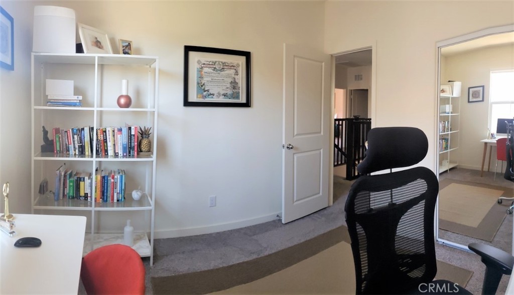 4120 Mission Tree Way Oceanside, CA 92057 - Photo 36 of 56 a view of a workspace with furniture and closet