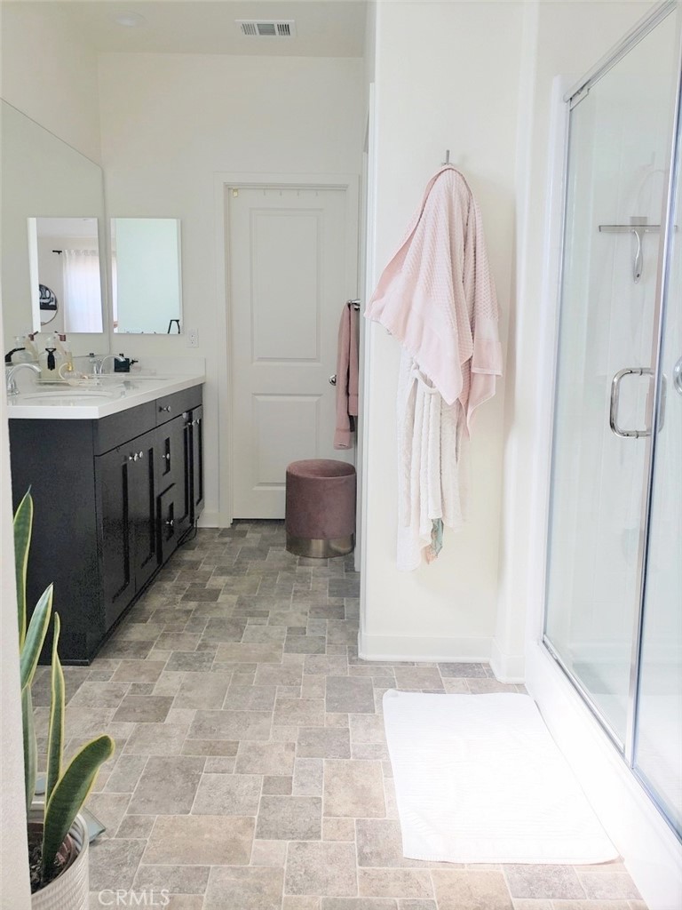 4120 Mission Tree Way Oceanside, CA 92057 - Photo 40 of 56 a bathroom with a sink and mirror