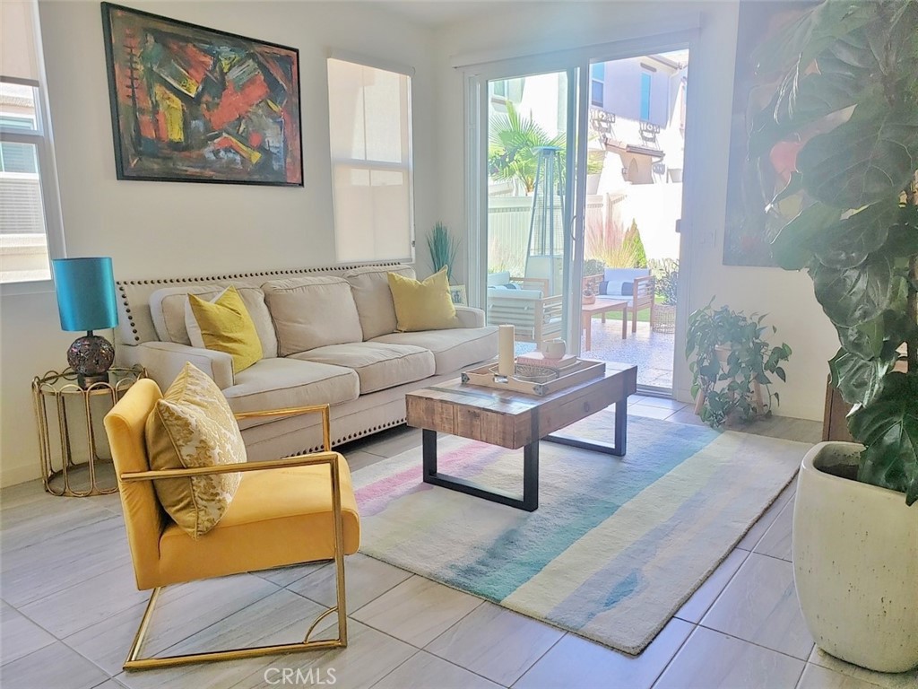 4120 Mission Tree Way Oceanside, CA 92057 - Photo 6 of 56 a living room with furniture a rug and a large window