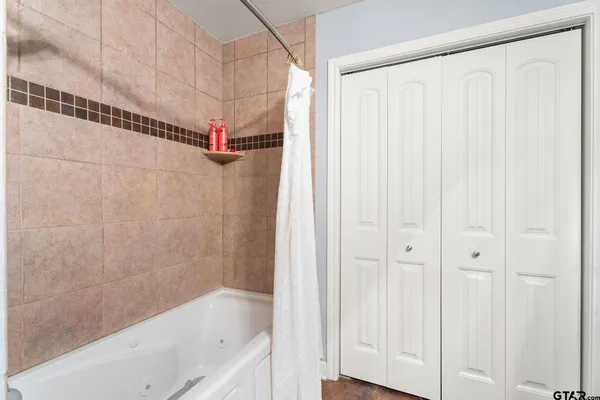 a bedroom with furniture a baby crib and a wooden floor