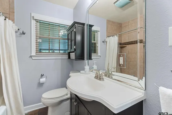 an aerial view of residential houses with outdoor space and river