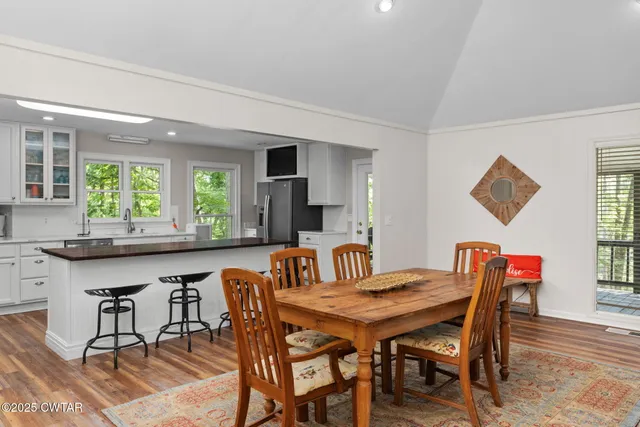 a dining room with furniture and window
