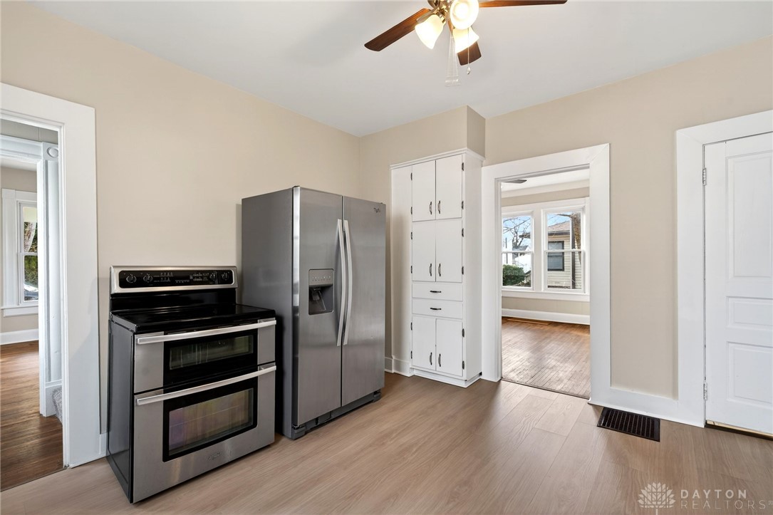 585 North Spring Street Wilmington, OH 45177 - Photo 9 of 21 This bright kitchen features modern appliances, a built-in pantry, and durable flooring for everyday living.