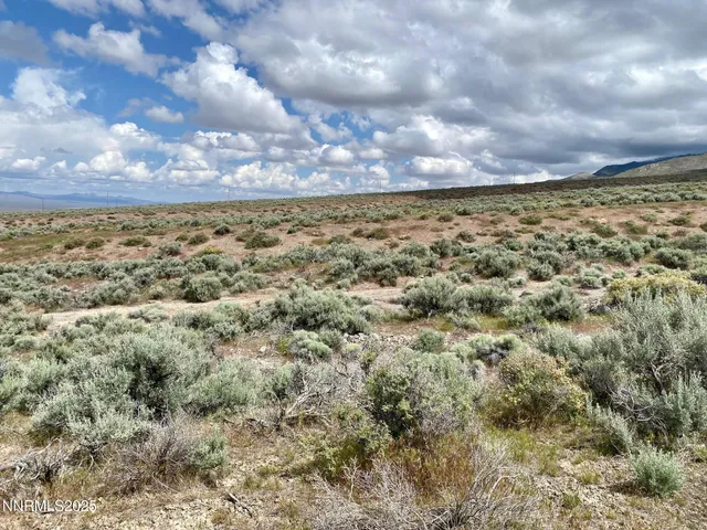 a view of mountain with sunset