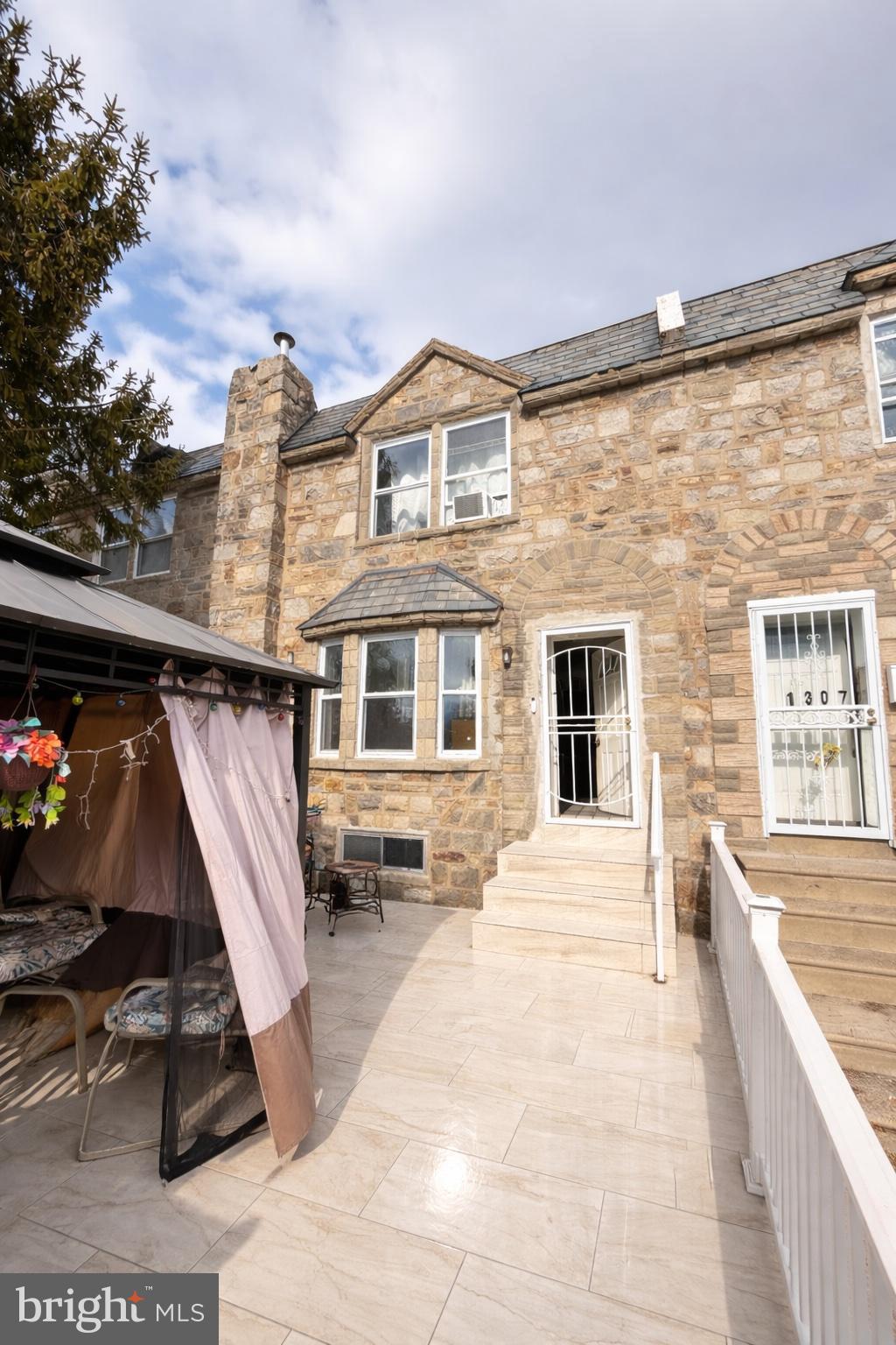 a view of a patio with a table and chairs