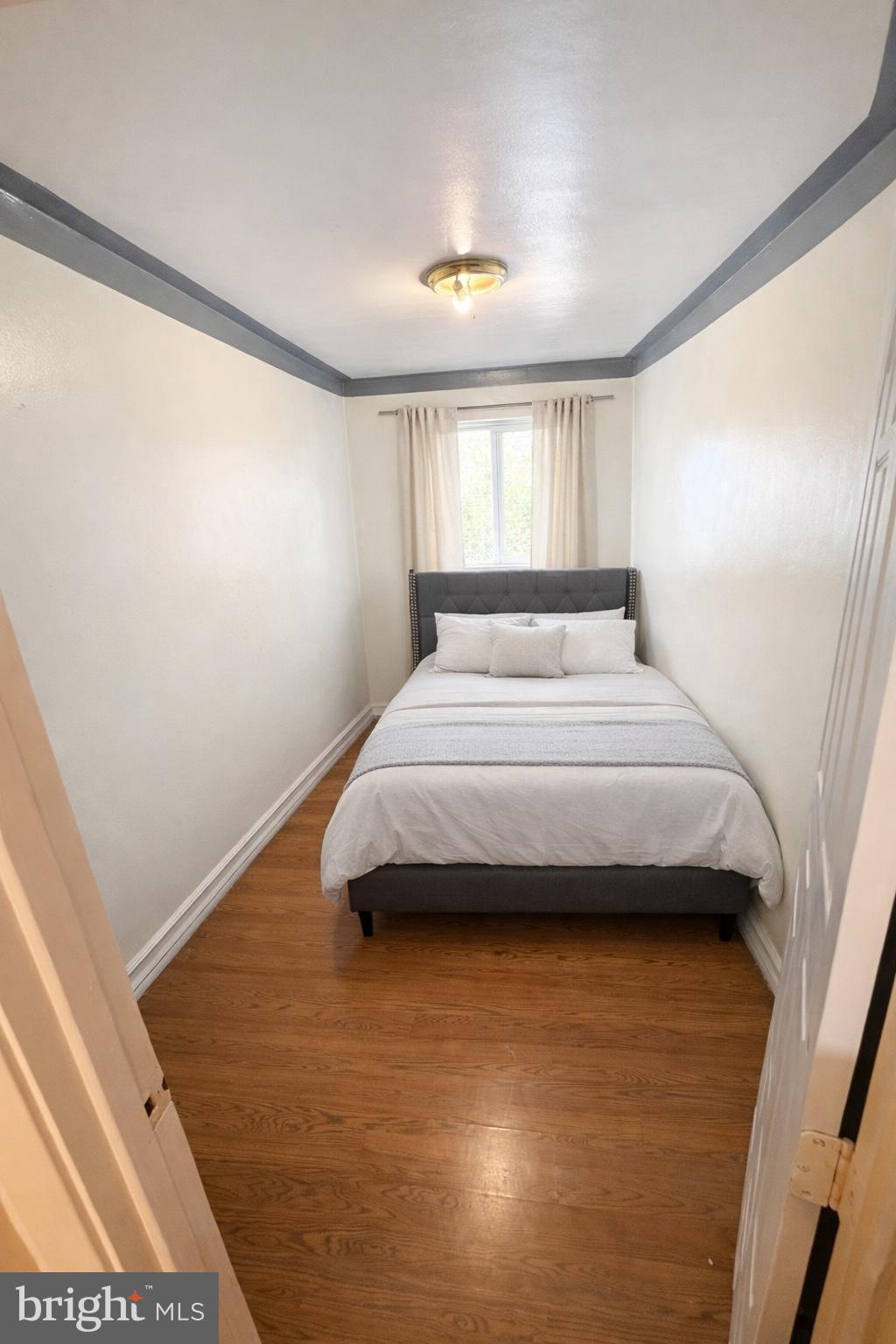 1305 Robbins Street Philadelphia, PA 19111 - Photo 11 of 19 a bedroom with a bed and a window