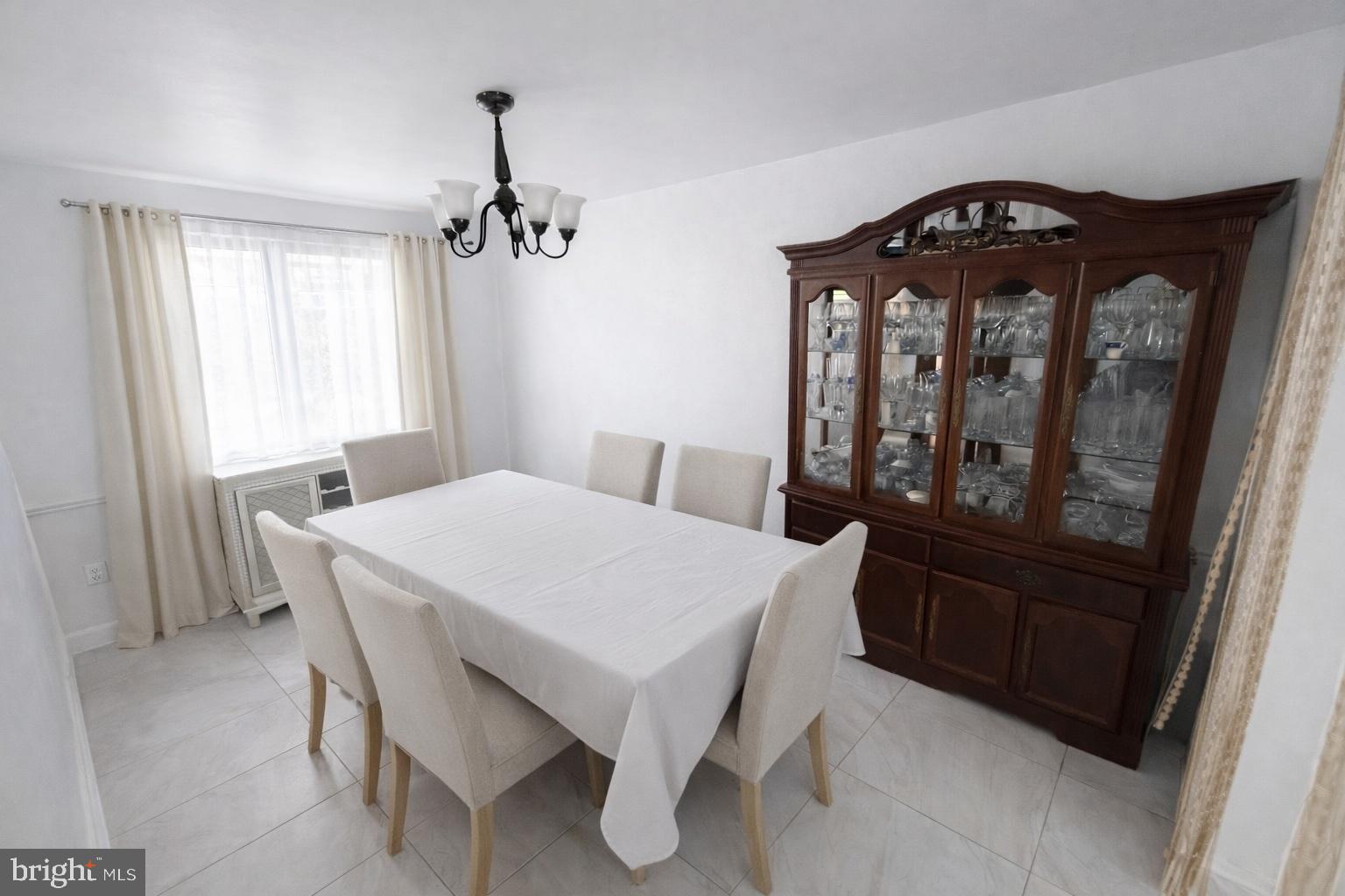 1305 Robbins Street Philadelphia, PA 19111 - Photo 4 of 19 a view of a dining room with furniture and window