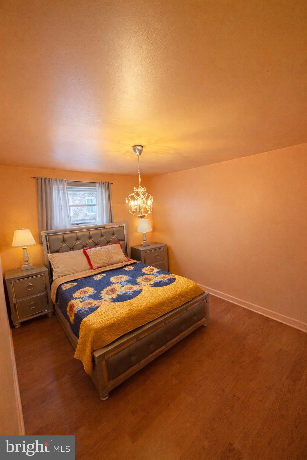 1305 Robbins Street Philadelphia, PA 19111 - Photo 10 of 19 a bedroom with a bed and a lamp