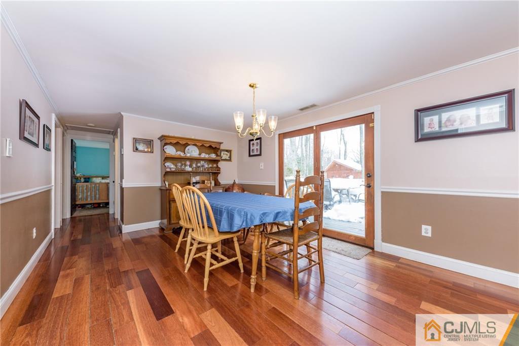 148 Rolling Ridge Road West Milford, NJ 07480 - Photo 12 of 25 a view of a dining room with furniture window and wooden floor