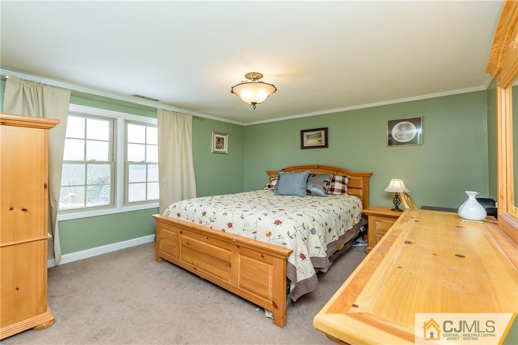 148 Rolling Ridge Road West Milford, NJ 07480 - Photo 13 of 25 a bedroom with a bed and a window