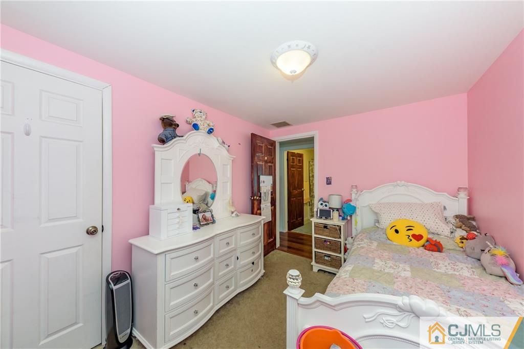 148 Rolling Ridge Road West Milford, NJ 07480 - Photo 16 of 25 a bedroom with a bed and a dresser
