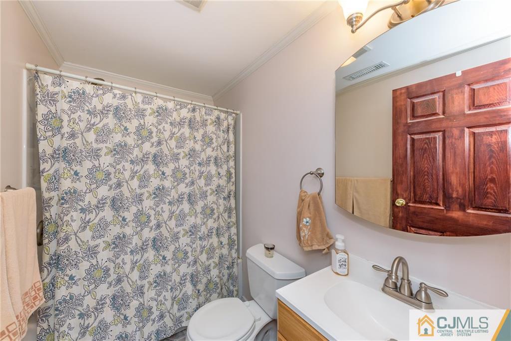 148 Rolling Ridge Road West Milford, NJ 07480 - Photo 17 of 25 a bathroom with a sink a toilet and shower curtain