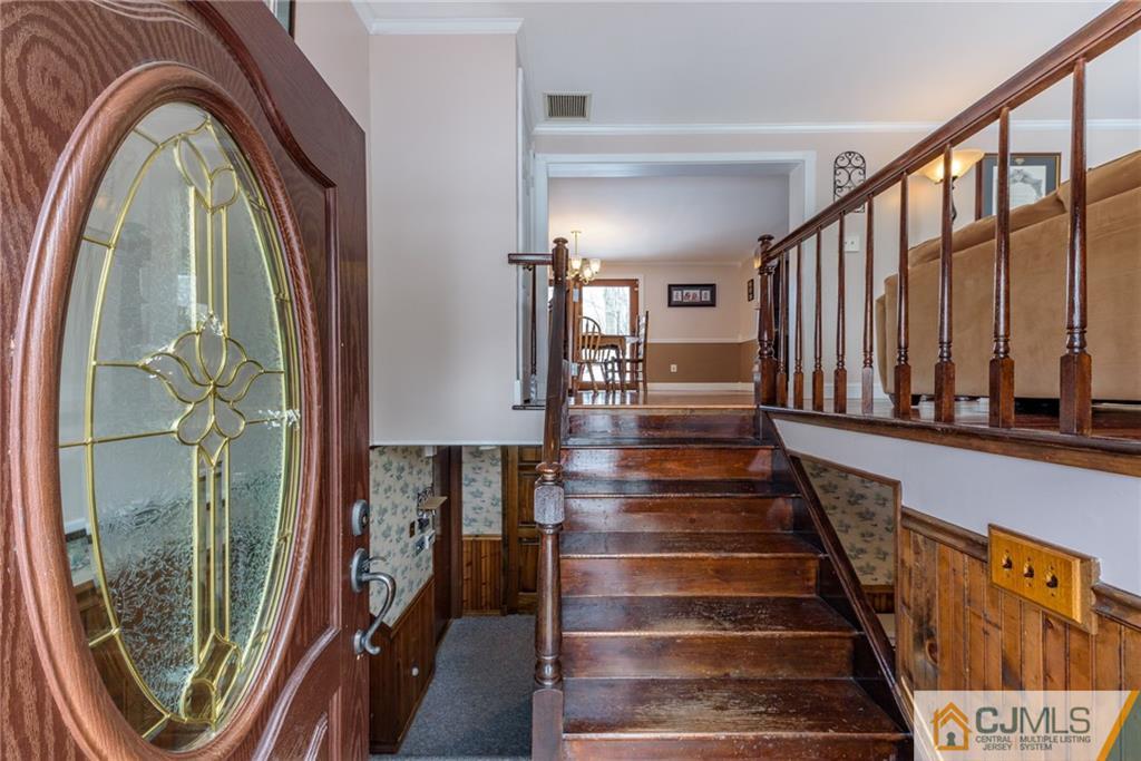 148 Rolling Ridge Road West Milford, NJ 07480 - Photo 3 of 25 a view of staircase with two black and white walls