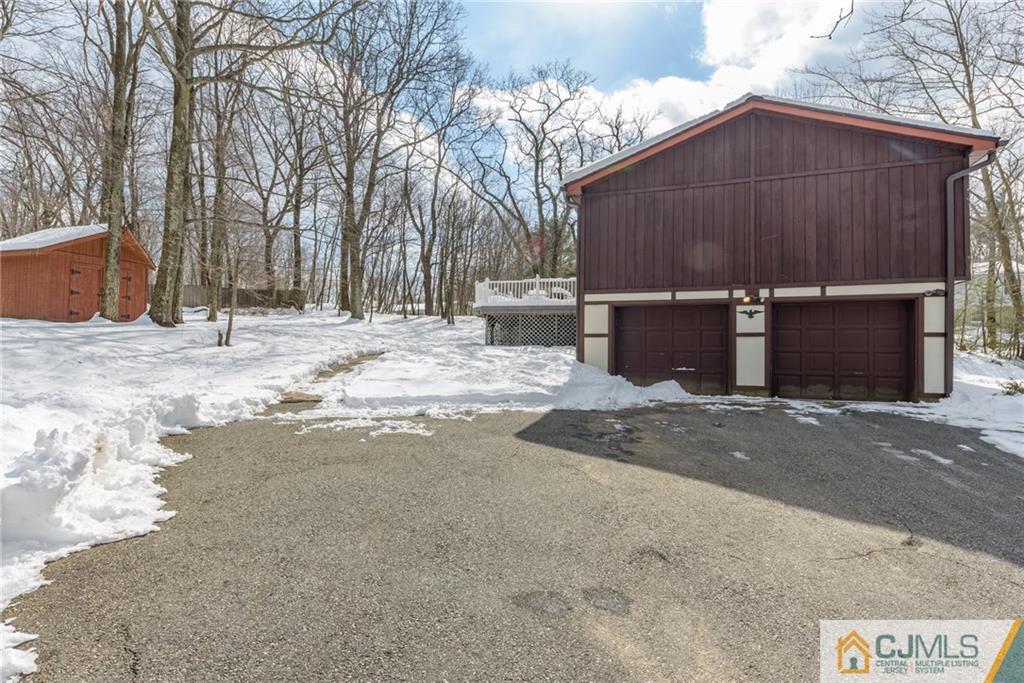 148 Rolling Ridge Road West Milford, NJ 07480 - Photo 24 of 25 a view of a house with a yard covered in snow