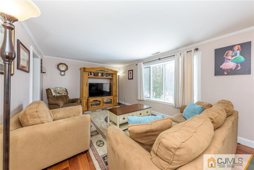 148 Rolling Ridge Road West Milford, NJ 07480 - Photo 4 of 25 a living room with furniture and a flat screen tv