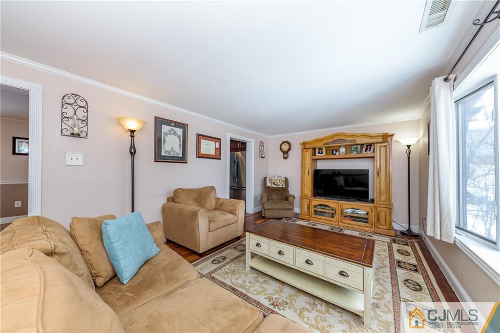 148 Rolling Ridge Road West Milford, NJ 07480 - Photo 5 of 25 a living room with furniture and a flat screen tv
