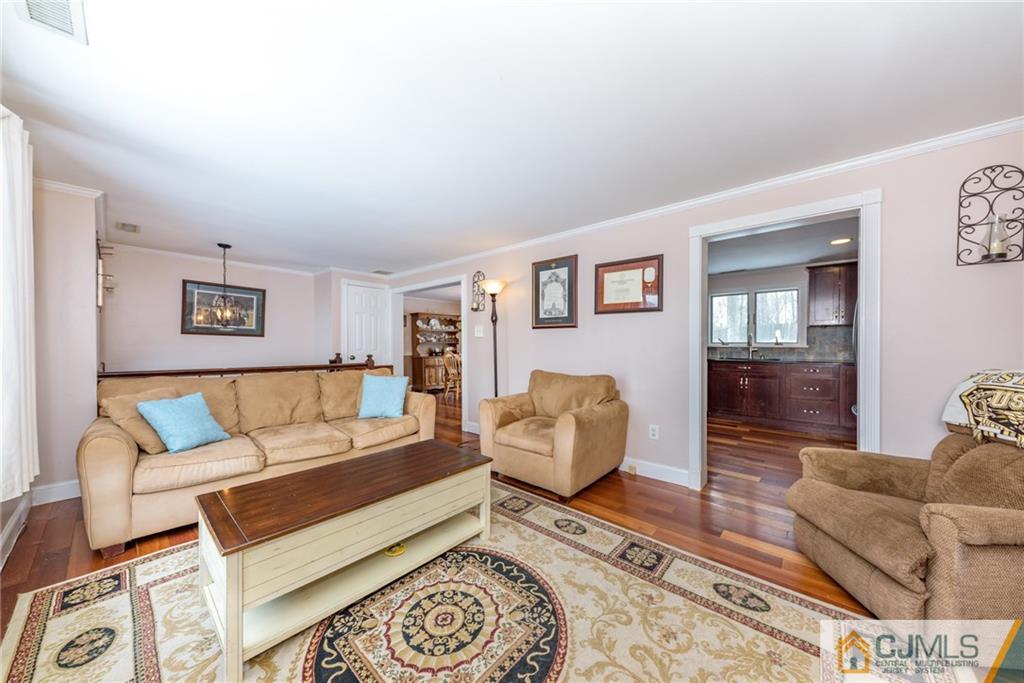 148 Rolling Ridge Road West Milford, NJ 07480 - Photo 6 of 25 a living room with furniture and wooden floor